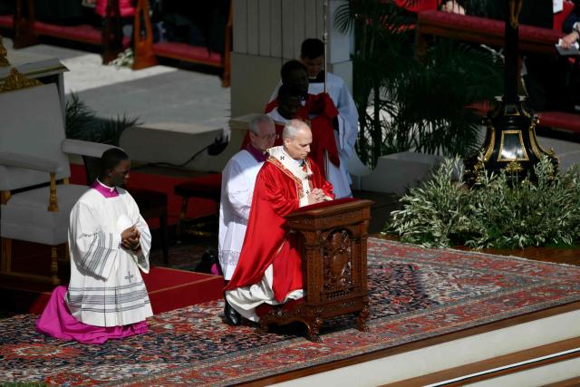 Pope Leo XIV leads a mass for Palm Sunday at St Peter's square in the Vatican on March 29, 2026. (Photo by Marco BERTORELLO / AFP)