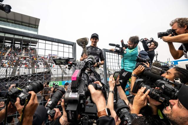 Mercedes' Italian driver Kimi Antonelli holds the trophy during a celebration with his team after winning the Formula One Japanese Grand Prix at the Suzuka circuit in Suzuka, Mie prefecture on March 29, 2026. (Photo by Philip FONG / AFP)