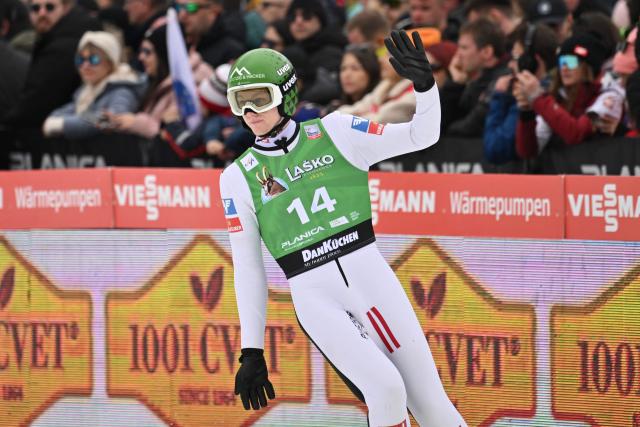 Austria's Jonas Schuster reacts during the final round of the Men's Individual Large Hill event at the FIS Jumping World Cup in Planica on March 29, 2026. (Photo by JURE MAKOVEC / AFP)