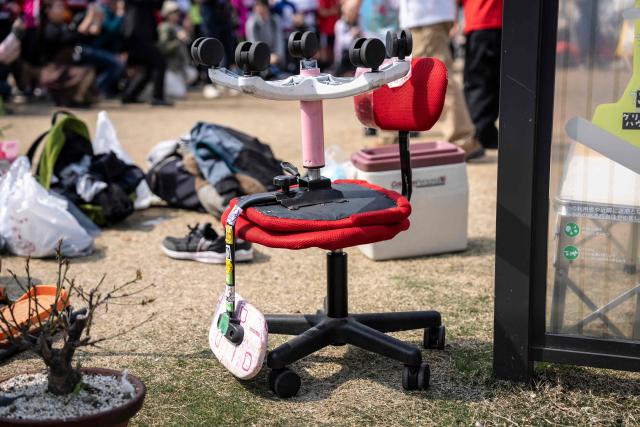 Office chairs are seen ahead of the ISU-1 Grand Prix in Kyotanabe, Kyoto prefecture on March 29, 2026. The ISU-1 Grand Prix is an endurance race supervised by the Japan Office Chair Racing Association (JORA), in which participants compete to see how many laps they can complete on office chairs over two hours. The event originated in 2010 in the Kirara shopping district of Kyotanabe, Kyoto Prefecture, and is now held at more than 20 locations across Japan. (Photo by Yuichi YAMAZAKI / AFP)