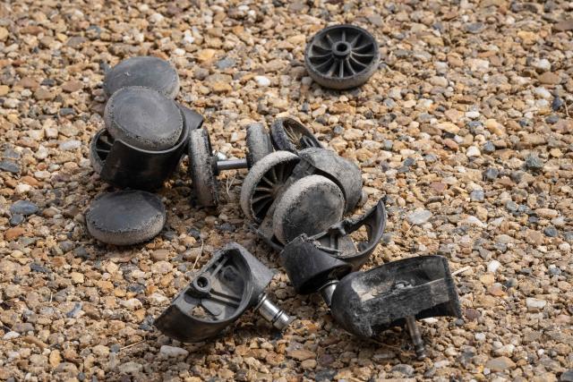 Broken office chair wheels are seen during the ISU-1 Grand Prix in Kyotanabe, Kyoto prefecture on March 29, 2026. The ISU-1 Grand Prix is an endurance race supervised by the Japan Office Chair Racing Association (JORA), in which participants compete to see how many laps they can complete on office chairs over two hours. The event originated in 2010 in the Kirara shopping district of Kyotanabe, Kyoto Prefecture, and is now held at more than 20 locations across Japan. (Photo by Yuichi YAMAZAKI / AFP)