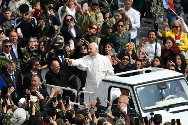 Pope Leo XIV leaves after the Palm Sunday mass at St Peter's square in the Vatican on March 29, 2026. (Photo by Marco BERTORELLO / AFP)