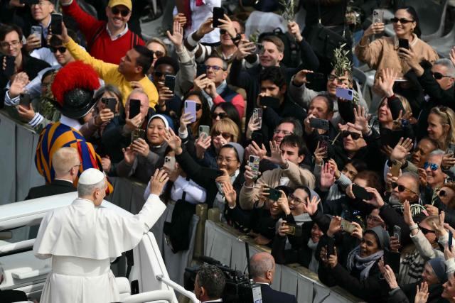 Pope Leo XIV leaves after the Palm Sunday mass at St Peter's square in the Vatican on March 29, 2026. (Photo by Marco BERTORELLO / AFP)