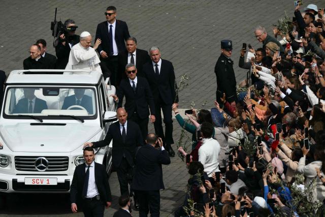 Pope Leo XIV leaves after the Palm Sunday mass at St Peter's square in the Vatican on March 29, 2026. (Photo by Marco BERTORELLO / AFP)