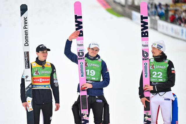(From L) Second-placed Slovenia's Domen Prevc, winner Norway's Marius Lindvik and third-placed Norway's Johann Andre Forfang celebrate on the podium after competing in the Men's Individual Large Hill event at the FIS Jumping World Cup in Planica on March 29, 2026. (Photo by JURE MAKOVEC / AFP)