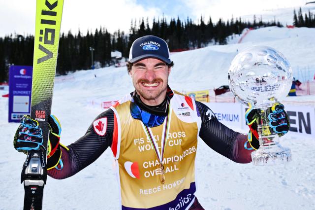 Canada's Reece Howden celebrates with the Crystal Globe after winning the men's FIS Ski Cross World Cup at Dundret in Gaellivare, Sweden, on March 29, 2026. (Photo by Anders WIKLUND / TT News Agency / AFP) / Sweden OUT