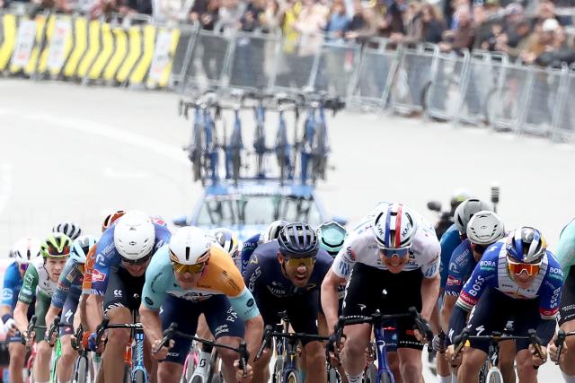 Team NSN Cycling Team's Australian rider Brady Gilmore (L) competes with Team Ineos' French rider Dorian Godon (R) before crossing first the finish line of the seventh and last stage of the 2026 'Volta a Catalunya' cycling tour of Catalonia, a 95,1 km race between Barcelona and Barcelona, on March 29, 2026. (Photo by Josep LAGO / AFP)