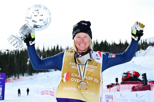 Sweden's Sandra Naeslund celebrates with the Crystal Globe after winning the final of the women's FIS Ski Cross World Cup at Dundret in Gaellivare, Sweden, on March 29, 2026. (Photo by Anders WIKLUND / TT News Agency / AFP) / Sweden OUT