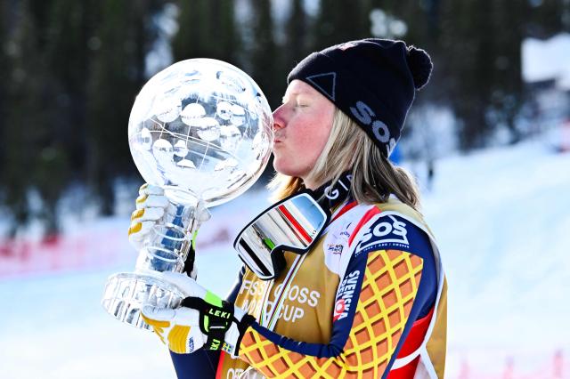 Sweden's Sandra Naeslund celebrates with the Crystal Globe after winning the final of the women's FIS Ski Cross World Cup at Dundret in Gaellivare, Sweden, on March 29, 2026. (Photo by Anders WIKLUND / TT News Agency / AFP) / Sweden OUT