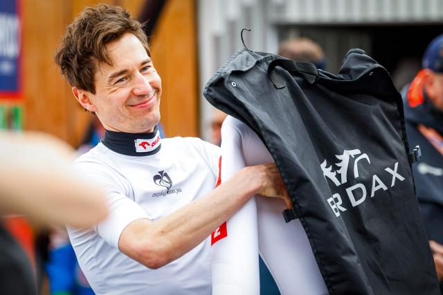 Poland’s Kamil Stoch celebrates the end of his career during the final round of the Flying Hill competition of the FIS Ski Jumping World Cup in Planica, Slovenia on March 29, 2026. (Photo by Jure Makovec / AFP)