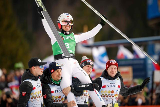 Poland’s Kamil Stoch celebrates the end of his career after the final round of the Flying Hill competition of the FIS Ski Jumping World Cup in Planica, Slovenia on March 29, 2026. (Photo by Jure Makovec / AFP)