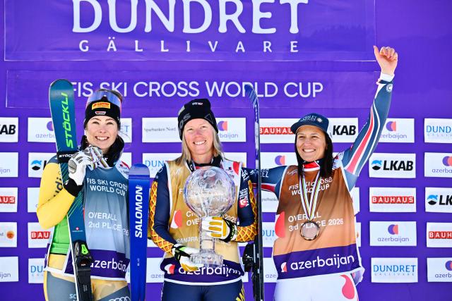 (L-R) Second-placed Germany's Daniela Maier, first-placed Sweden's Sandra Naslund and third-placed France's Marielle Berger Sabbatel celebrate on the podium after winning  the women's FIS Ski Cross World Cup at Dundret in Gaellivare, Sweden, on March 29, 2026. (Photo by Anders WIKLUND / TT News Agency / AFP) / Sweden OUT