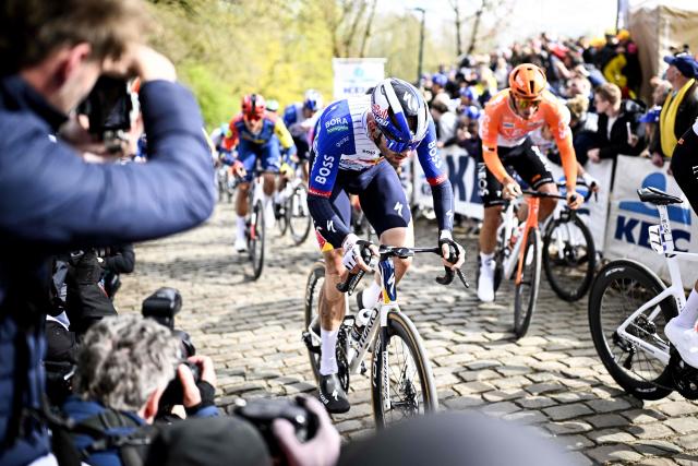 Belgian rider Jordi Meeus of Red Bull-BORA-hansgrohe (C) climbs the Kemmelberg during the men elite 'Middelkerke-Wevelgem - In Flanders Fields' one day cycling race, 240.8 km from Middelkerke to Wevelgem, on March 29, 2026. (Photo by JASPER JACOBS / Belga / AFP) / Belgium OUT