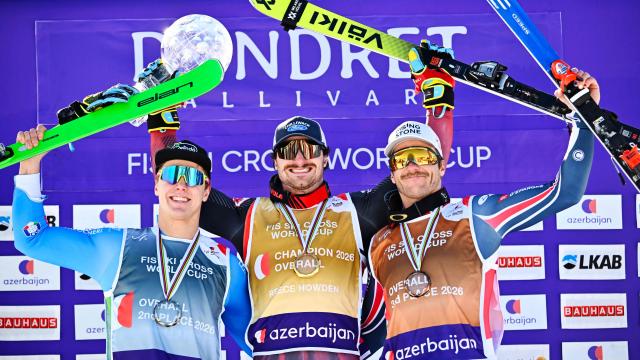 (L-R) Second-placed Italy's Simone Deromedis, first-placed Canada's Reece Howden and third-placed Italy's Edoardo Zorzi celebrate on the podium after winning the men's FIS Ski Cross World Cup at Dundret in Gaellivare, Sweden, on March 29, 2026. (Photo by Anders WIKLUND / TT News Agency / AFP) / Sweden OUT