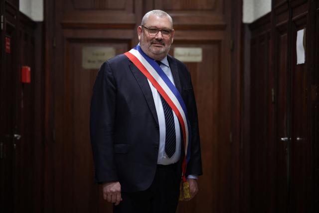 French politician of the National Rally (RN) far right party and newly elected mayor of Carcassonne Christophe Barthes poses after a vote by the city council in the town hall in Carcassonne, southern France, on March 29, 2026. (Photo by Valentine CHAPUIS / AFP)