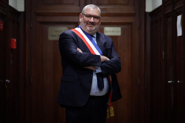 French politician of the National Rally (RN) far right party and newly elected mayor of Carcassonne Christophe Barthes poses after a vote by the city council in the town hall in Carcassonne, southern France, on March 29, 2026. (Photo by Valentine CHAPUIS / AFP)