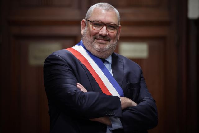 French politician of the National Rally (RN) far right party and newly elected mayor of Carcassonne Christophe Barthes poses after a vote by the city council in the town hall in Carcassonne, southern France, on March 29, 2026. (Photo by Valentine CHAPUIS / AFP)