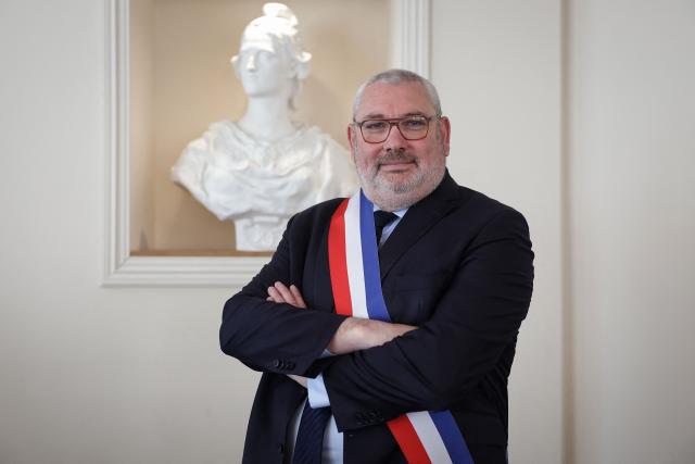 French politician of the National Rally (RN) far right party and newly elected mayor of Carcassonne Christophe Barthes poses after a vote by the city council in the town hall in Carcassonne, southern France, on March 29, 2026. (Photo by Valentine CHAPUIS / AFP)