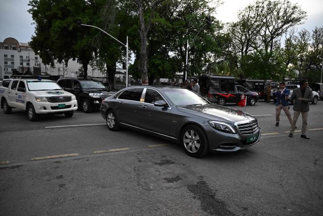A motorcade (R) of Turkey's Foreign Minister Hakan Fidan departs from Pakistan's Ministry of Foreign Affairs premises in Islamabad on March 29, 2026. Foreign ministers from Pakistan, Saudi Arabia, Egypt and Turkey met on March 29 for talks on the war in the Middle East, with Islamabad acting as a go-between for the United States and Iran. (Photo by Aamir QURESHI / AFP)