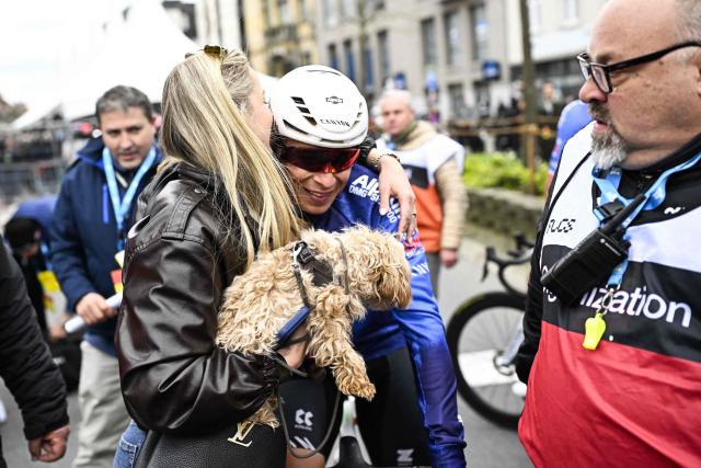 Belgian Jasper Philipsen and his partner Melanie Peetermans celebrate after winning the men elite 'Middelkerke-Wevelgem - In Flanders Fields' one day cycling race, 240.8 km from Middelkerke to Wevelgem, on March 29, 2026. (Photo by JASPER JACOBS / Belga / AFP) / Belgium OUT