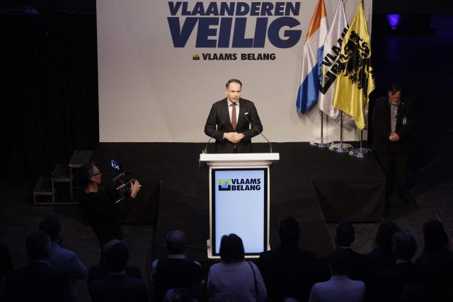 Far right party Vlaams Belang's chairman Tom Van Grieken delivers a speech at the 'Vlaanderen Veilig' (Flanders Safe) meeting of Flemish far-right party Vlaams Belang (VB), in Brussels on March 29, 2026. (Photo by NICOLAS MAETERLINCK / Belga / AFP) / Belgium OUT
