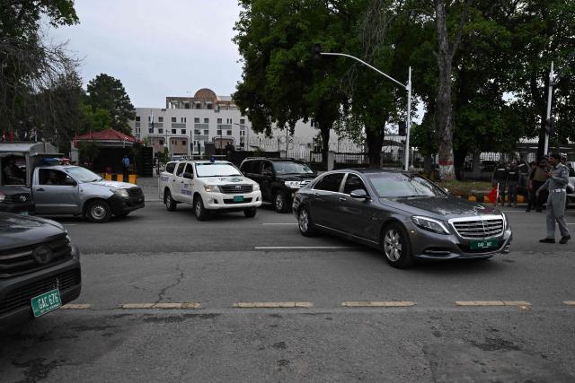 A motorcade (R) of Turkey's Foreign Minister Hakan Fidan departs from Pakistan's Ministry of Foreign Affairs premises in Islamabad on March 29, 2026. Foreign ministers from Pakistan, Saudi Arabia, Egypt and Turkey met on March 29 for talks on the war in the Middle East, with Islamabad acting as a go-between for the United States and Iran. (Photo by Aamir QURESHI / AFP)