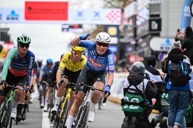 Belgian Jasper Philipsen of Alpecin-Premier Tech celebrates after winning the men elite 'Middelkerke-Wevelgem - In Flanders Fields' one day cycling race, 240.8 km from Middelkerke to Wevelgem, on March 29, 2026. (Photo by ELIAS ROM / Belga / AFP) / Belgium OUT