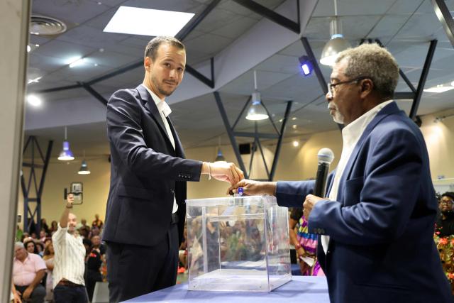 Alexis Chaussalet, the newly elected mayor of Le Tampon and a member of the left-wing La France Insoumise (LFI) party, casts his vote during the inaugural session of the new municipal council in Le Tampon, on the French Indian Ocean island of Réunion, on March 29, 2026. (Photo by Richard BOUHET / AFP)