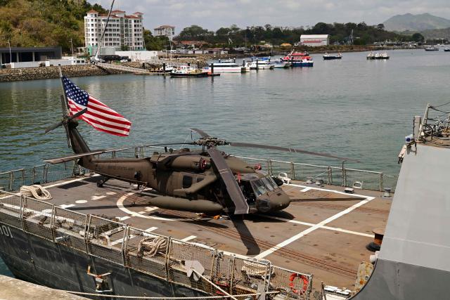 A US Army helicopter is stationed on the US Navy Arleigh Burke-class guided-missile destroyer USS Gridley (DDG 101), docked at the Amador cruise terminal in Panama City on March 29, 2026. The ship reached the country alongside the aircraft carrier USS Nimitz as part of the multinational maritime cooperation exercises “Mares del Sur 2026.” (Photo by MARTIN BERNETTI / AFP)
