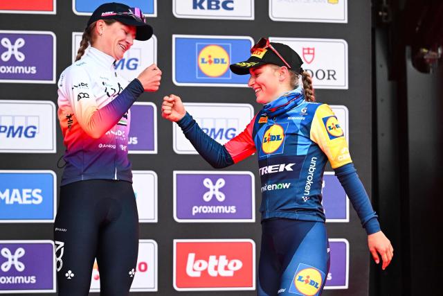 Dutch Karlijn Swinkels of UAE Team ADQ (L) and Belgian Fleur Moors of Lidl-Trek shakes hands on the podium after the women elite 'Wevelgem to Wevelgem - In Flanders Fields' one day cycling race, 134.9 km from and to Wevelgem, on March 29, 2026. (Photo by MAARTEN STRAETEMANS / Belga / AFP) / Belgium OUT