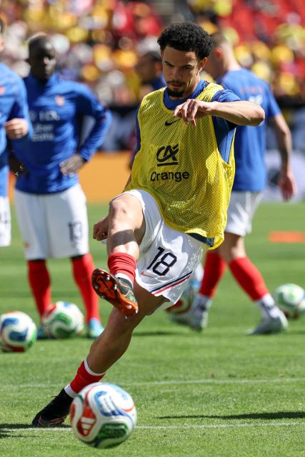 France's midfielder #18 Warren Zaire-Emery warms up before the start of a friendly football match between Colombia and France at Northwest Stadium in Landover, Maryland, on March 29, 2026. (Photo by FRANCK FIFE / AFP)