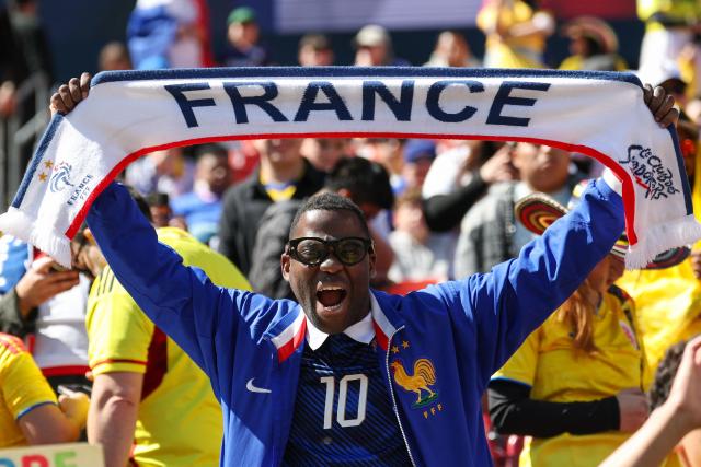 A supporter of France cheers in the stands before the start of a friendly football match between Colombia and France at Northwest Stadium in Landover, Maryland, on March 29, 2026. (Photo by FRANCK FIFE / AFP)