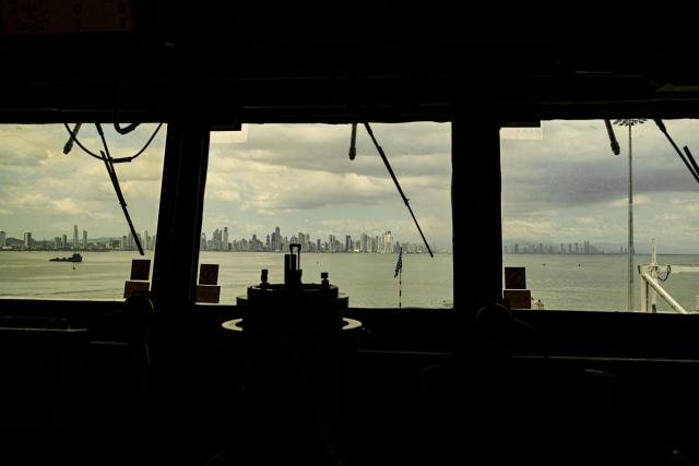 This view shows Panama City through the windows of the ship’s bridge of the US Navy Arleigh Burke–class guided-missile destroyer USS Gridley (DDG 101), docked at the Amador cruise terminal in Panama City on March 29, 2026. The ship reached the country alongside the aircraft carrier USS Nimitz as part of the multinational maritime cooperation exercises “Mares del Sur 2026.” (Photo by MARTIN BERNETTI / AFP)