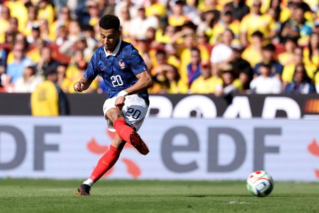 TOPSHOT - France's forward #20 Desire Doue shoots to score his second goal during a friendly football match between Colombia and France at Northwest Stadium in Landover, Maryland, on March 29, 2026. (Photo by FRANCK FIFE / AFP)