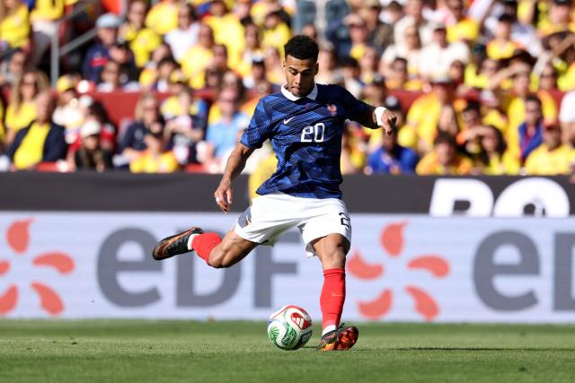 France's forward #20 Desire Doue shoots to score his second goal during a friendly football match between Colombia and France at Northwest Stadium in Landover, Maryland, on March 29, 2026. (Photo by FRANCK FIFE / AFP)
