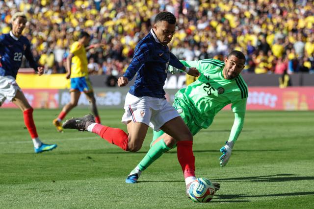 France's forward #10 Kylian Mbappe shoots past Colombia's goalkeeper #25 Alvaro Montero in an attempt to score a goal unvalidated for being offside during a friendly football match between Colombia and France at Northwest Stadium in Landover, Maryland, on March 29, 2026. (Photo by FRANCK FIFE / AFP)