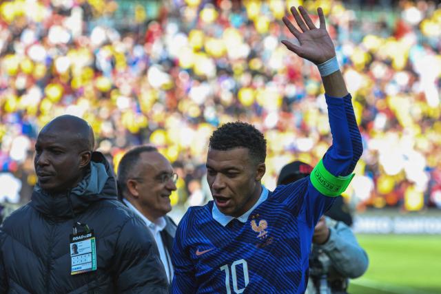 France's forward #10 Kylian Mbappe waves at the end of a friendly football match between Colombia and France at Northwest Stadium in Landover, Maryland, on March 29, 2026. (Photo by FRANCK FIFE / AFP)