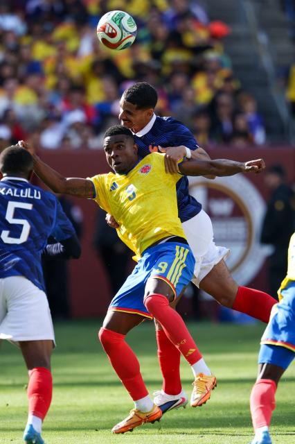 Colombia's forward #09 Jhon Cordoba and France's defender #17 Maxence Lacroix fight for the ball during a friendly football match between Colombia and France at Northwest Stadium in Landover, Maryland, on March 29, 2026. (Photo by FRANCK FIFE / AFP)