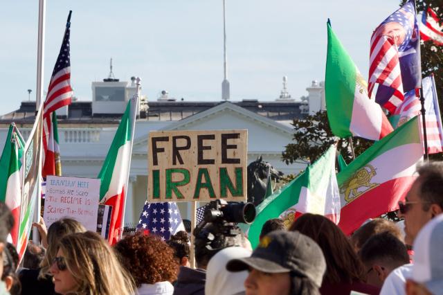 A protester holds a sign reading "free Iran" near the White House during a rally in support of Iranians' fight for freedom, in Washington, DC, on March 29, 2026. The event, organized by DCProtests4Iran, brought together members of the Iranian diaspora from the Washington, DC metropolitan area and surrounding states. (Photo by Amid FARAHI / AFP)