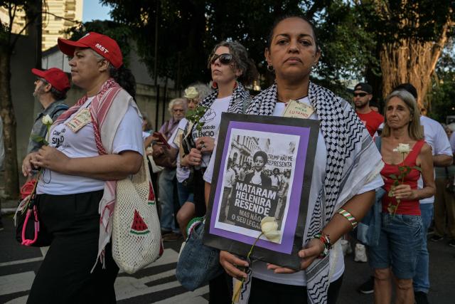 Relatives and social activists attend a silent march in memory of the victims of state violence during the 1964 dictatorship in Sao Paulo, Brazil on March 29, 2026. (Photo by NELSON ALMEIDA / AFP)
