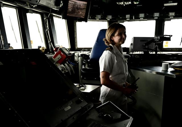 An officers show the ship's bridge of the USS Navy Arleigh Burke-class guided-missile destroyer USS Gridley (DDG 101), docked at the Amador cruise terminal in Panama City on March 29, 2026. The ship reached the country alongside the aircraft carrier USS Nimitz as part of the multinational maritime cooperation exercises “Mares del Sur 2026.” (Photo by MARTIN BERNETTI / AFP)