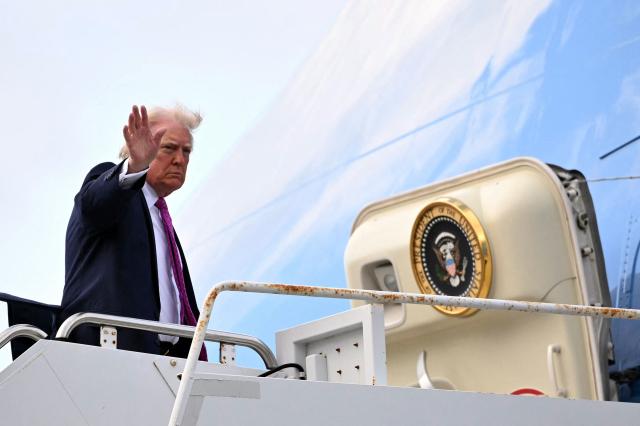 US President Donald Trump boards Air Force One prior to departure from Palm Beach International Airport in West Palm Beach, Florida, March 29, 2026. US President Donald Trump is returning to the White House after spending the weekend at his Mar-a-Lago residence. (Photo by Mandel NGAN / AFP)