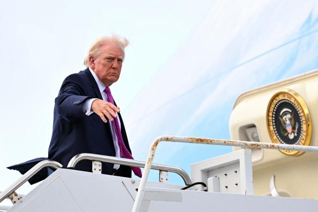 US President Donald Trump boards Air Force One prior to departure from Palm Beach International Airport in West Palm Beach, Florida, March 29, 2026. US President Donald Trump is returning to the White House after spending the weekend at his Mar-a-Lago residence. (Photo by Mandel NGAN / AFP)