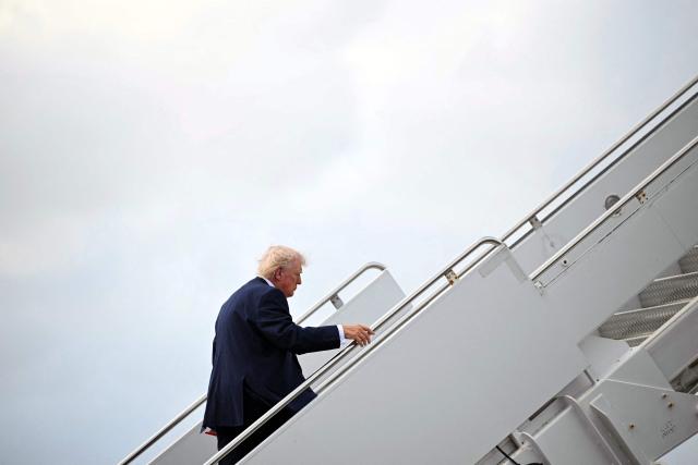 US President Donald Trump boards Air Force One prior to departure from Palm Beach International Airport in West Palm Beach, Florida, March 29, 2026. US President Donald Trump is returning to the White House after spending the weekend at his Mar-a-Lago residence. (Photo by Mandel NGAN / AFP)
