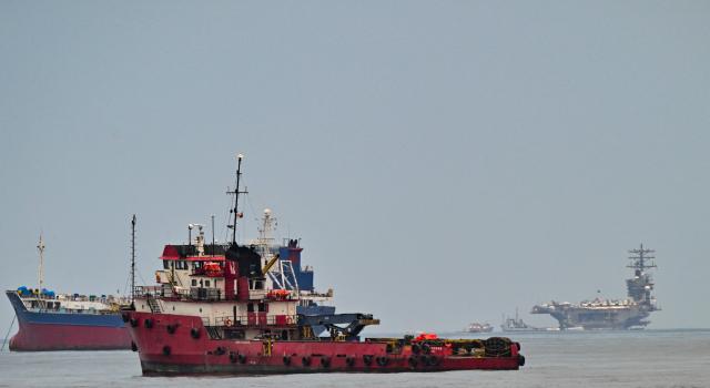 The US Navy aircraft carrier USS Nimitz (R) sails on Panama Bay near Panama City on March 29, 2026. The ship reached the country alongside the guided-missile destroyer USS Gridley (DDG 101), as part of the multinational maritime cooperation exercises “Mares del Sur 2026.” (Photo by MARTIN BERNETTI / AFP)