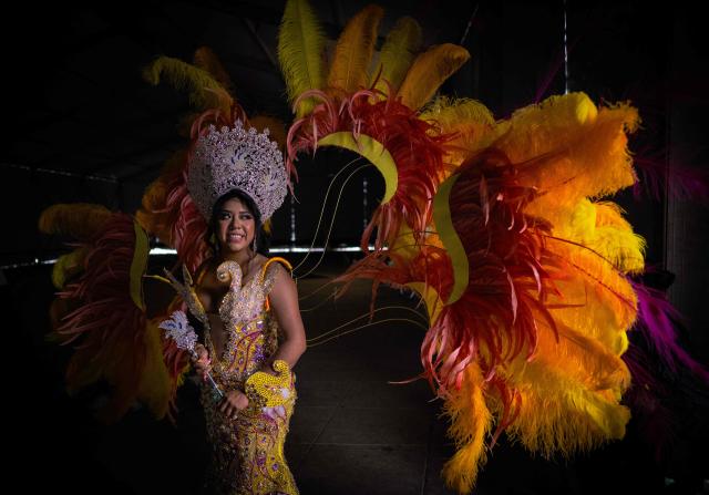 A woman waits to take part in the annual spring carnival parade in Mexico City on March 29, 2026. (Photo by Carl de Souza / AFP)
