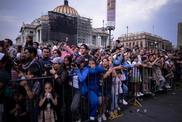 People watch the annual spring carnival parade in Mexico City on March 29, 2026. (Photo by Carl de Souza / AFP)