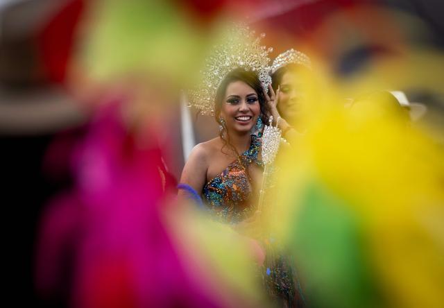 A woman takes part in the annual spring carnival parade in Mexico City on March 29, 2026. (Photo by Carl de Souza / AFP)