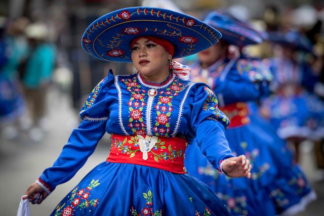 A woman takes part in the annual spring carnival parade in Mexico City on March 29, 2026. (Photo by Carl de Souza / AFP)