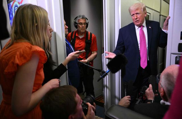 Donald Trump speaks to reporters aboard Air Force One en route to Joint Base Andrews, Maryland, on March 29, 2026. US President Donald Trump is returning to White House after spending the weekend at his Mar-A-Lago residence. (Photo by Mandel NGAN / AFP)